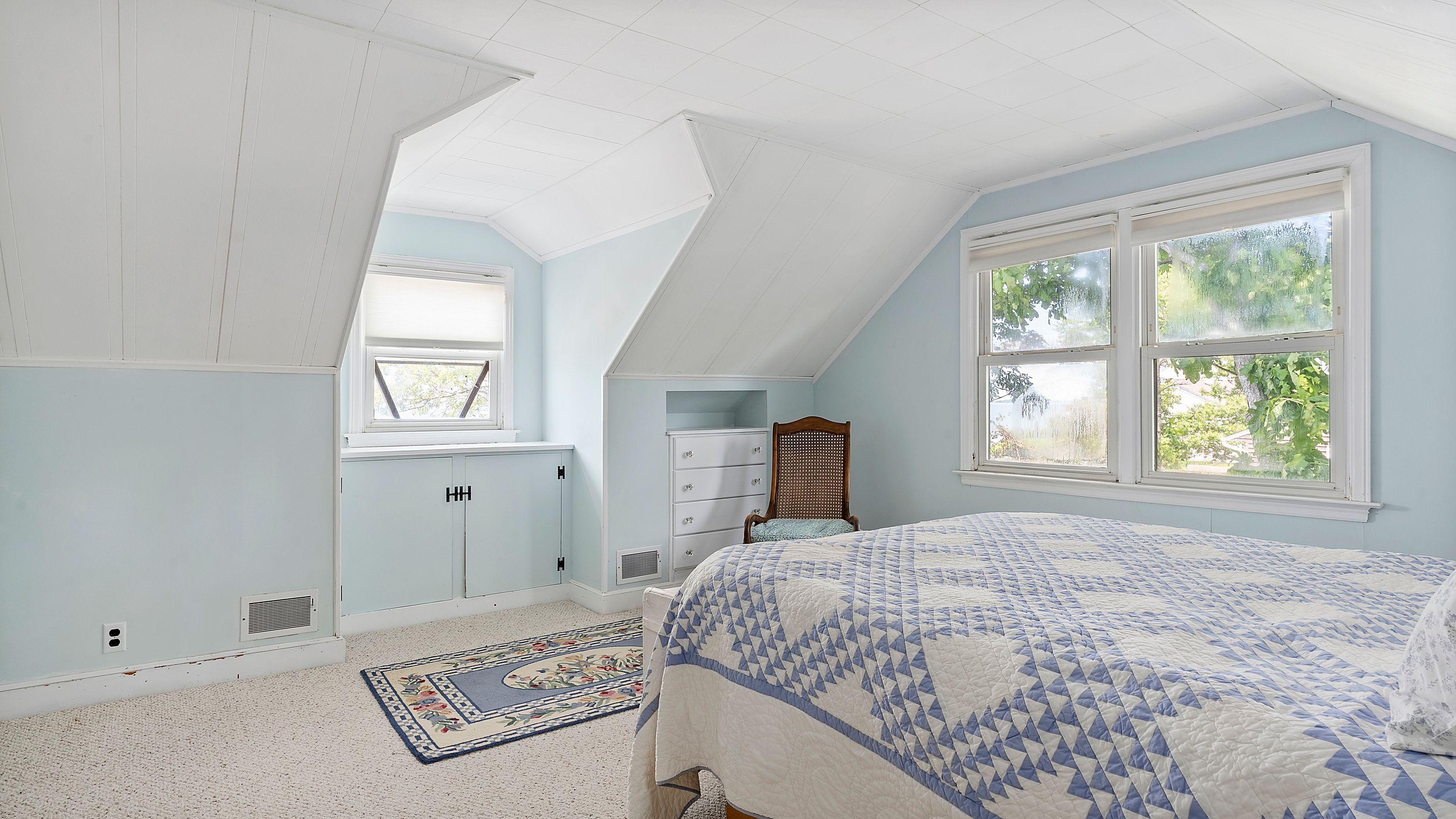 55 East Shore Road Southampton, NY 11968 - Photo 11 of 19 a bedroom with a bed and a window
