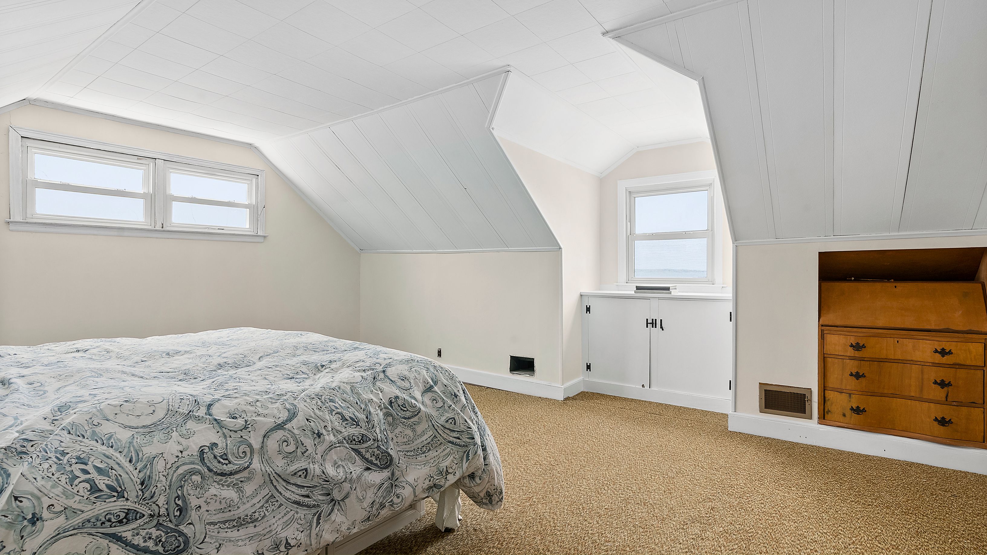 55 East Shore Road Southampton, NY 11968 - Photo 12 of 19 a bedroom with a bed and a window