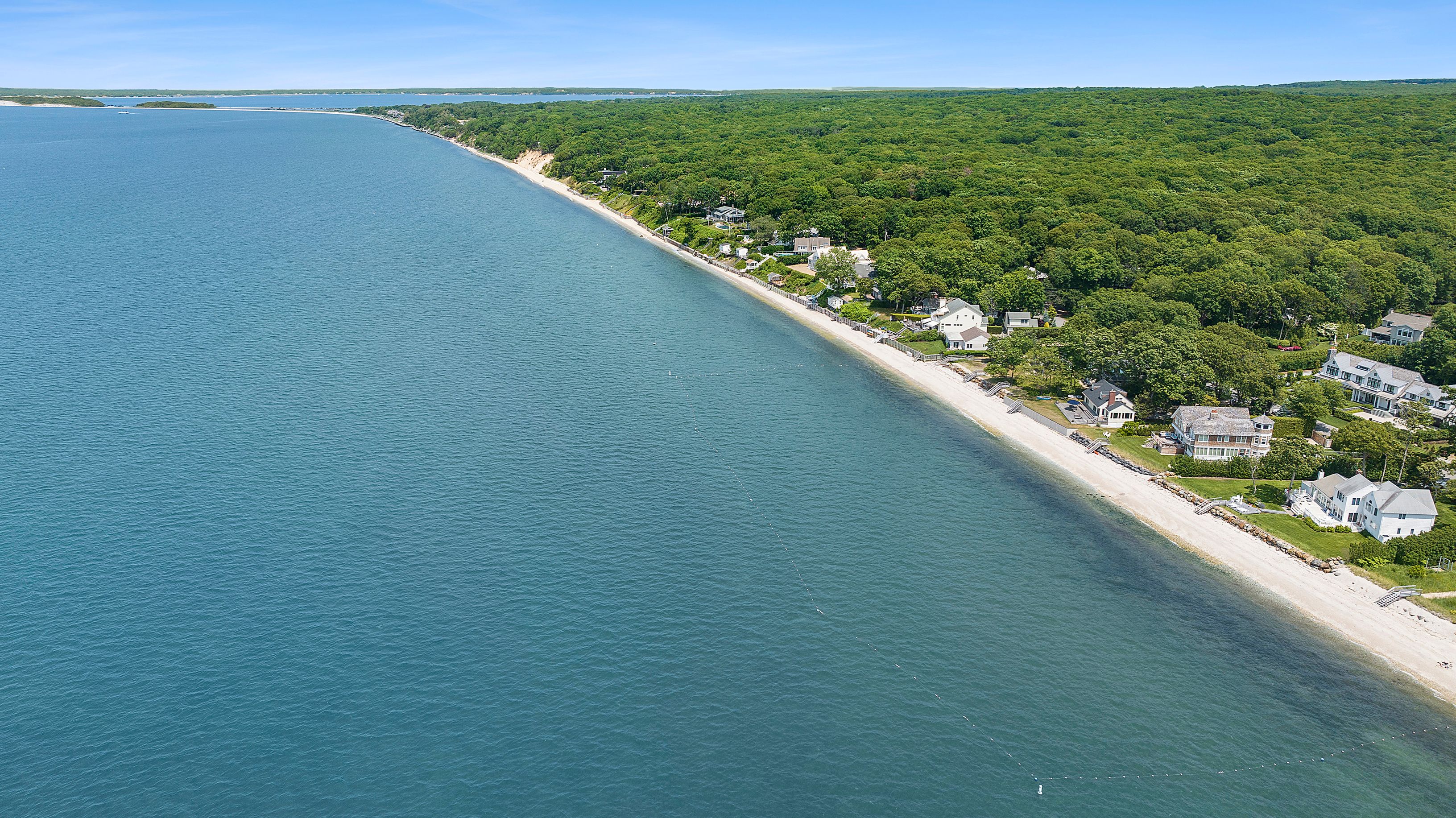 55 East Shore Road Southampton, NY 11968 - Photo 3 of 19 a view of a floor to ceiling window and an ocean view