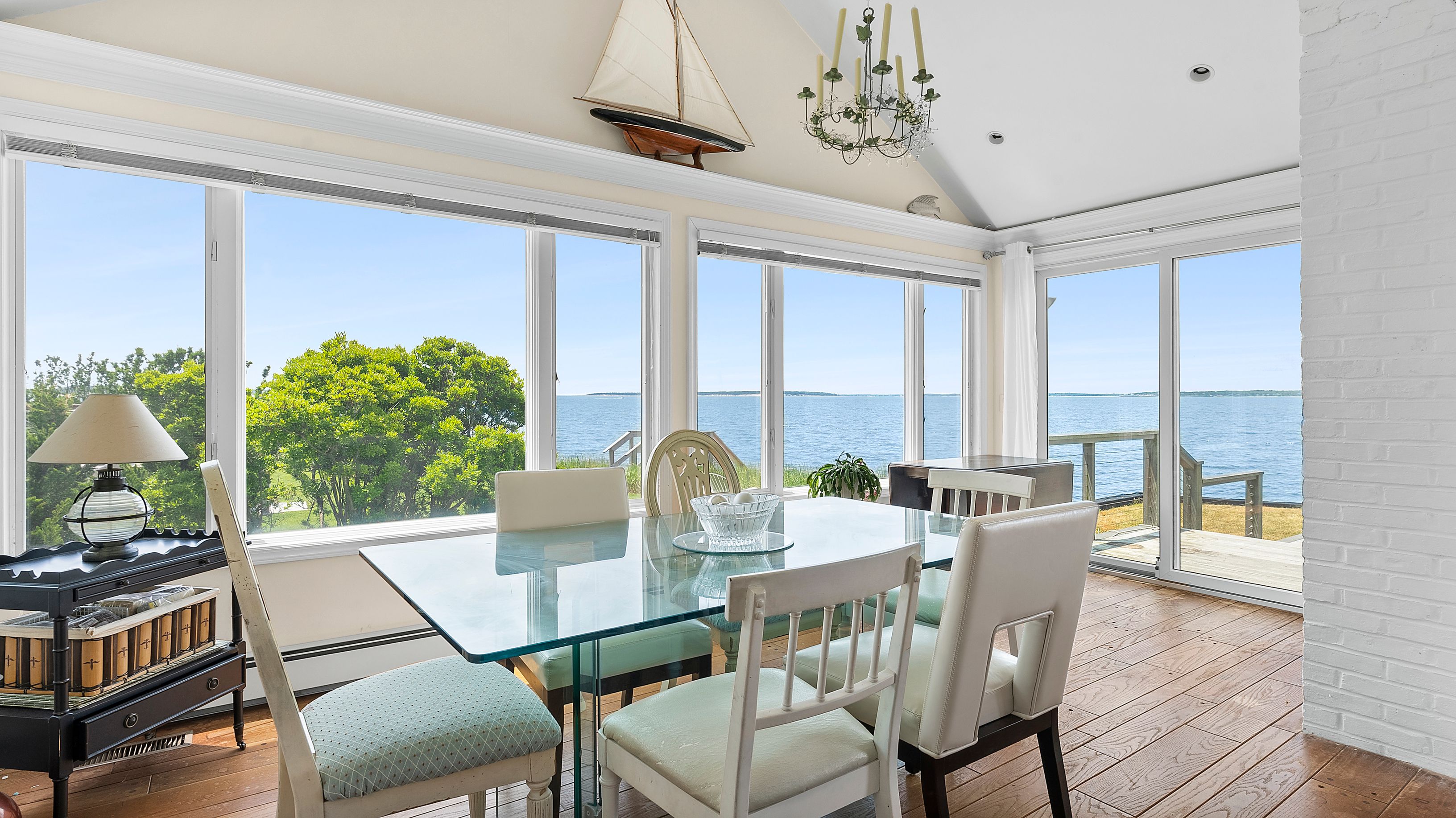55 East Shore Road Southampton, NY 11968 - Photo 9 of 19 a view of a dining room with furniture window and outside view