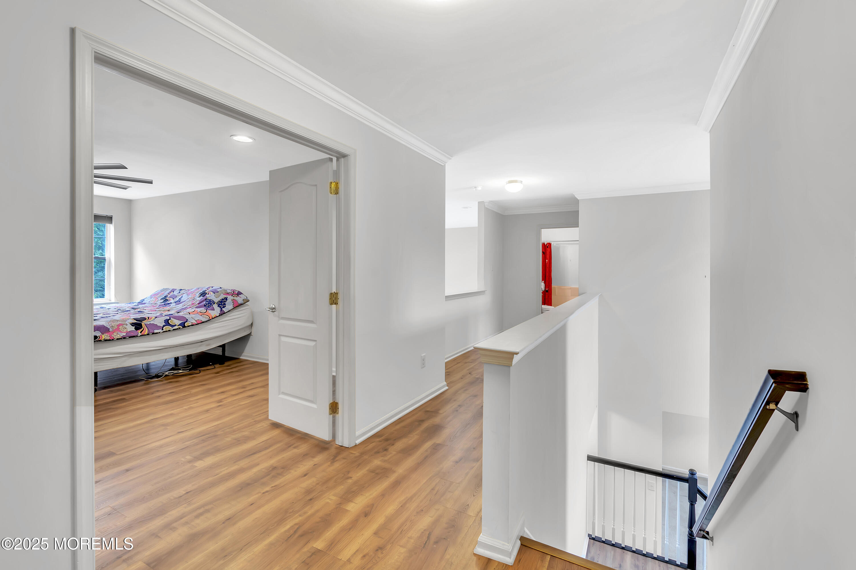 4 Christopher Drive Howell, NJ 07731 - Photo 15 of 41 a bedroom with wooden floor and furniture