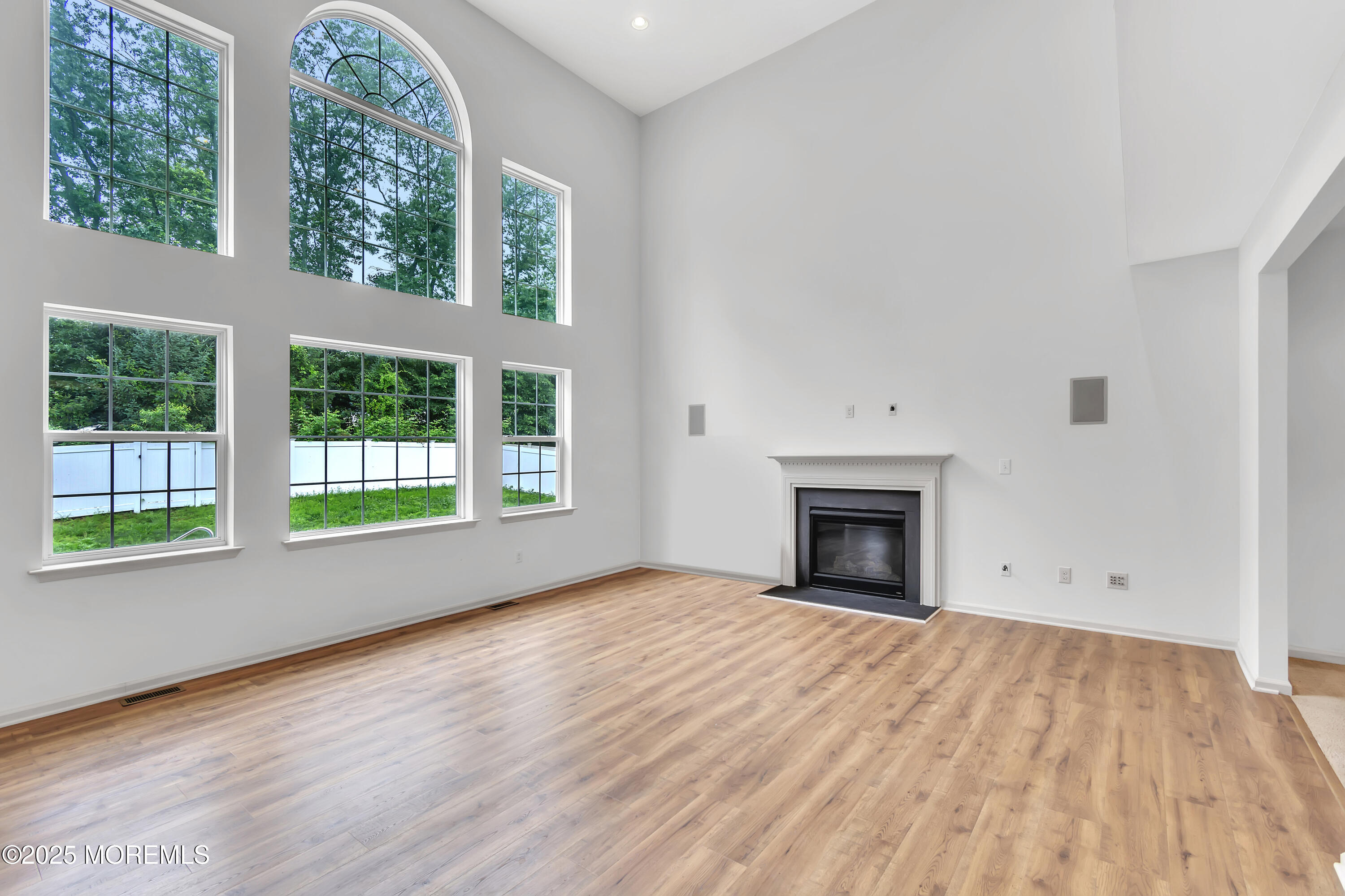4 Christopher Drive Howell, NJ 07731 - Photo 29 of 41 a view of empty room with wooden floor and fireplace