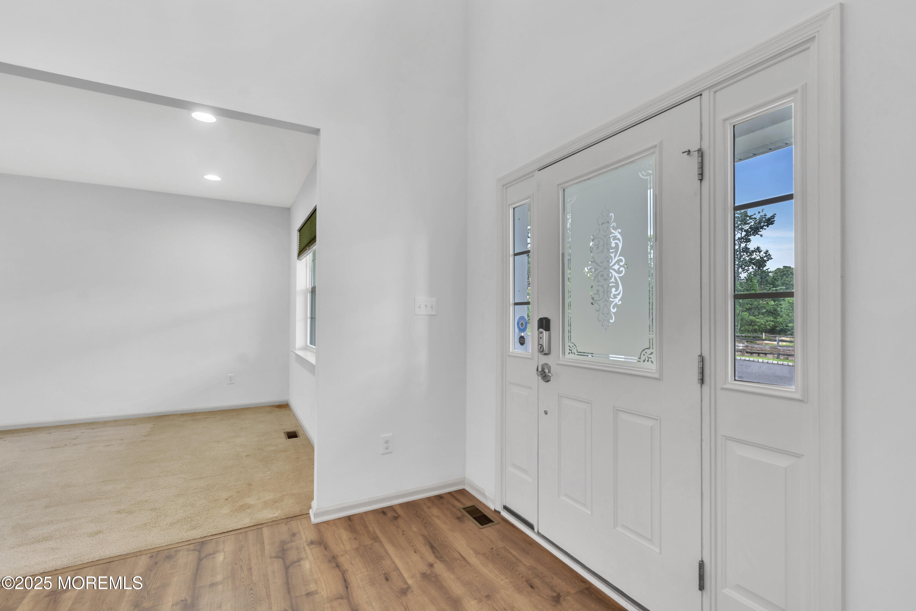 4 Christopher Drive Howell, NJ 07731 - Photo 33 of 41 wooden floor in an empty room with a window