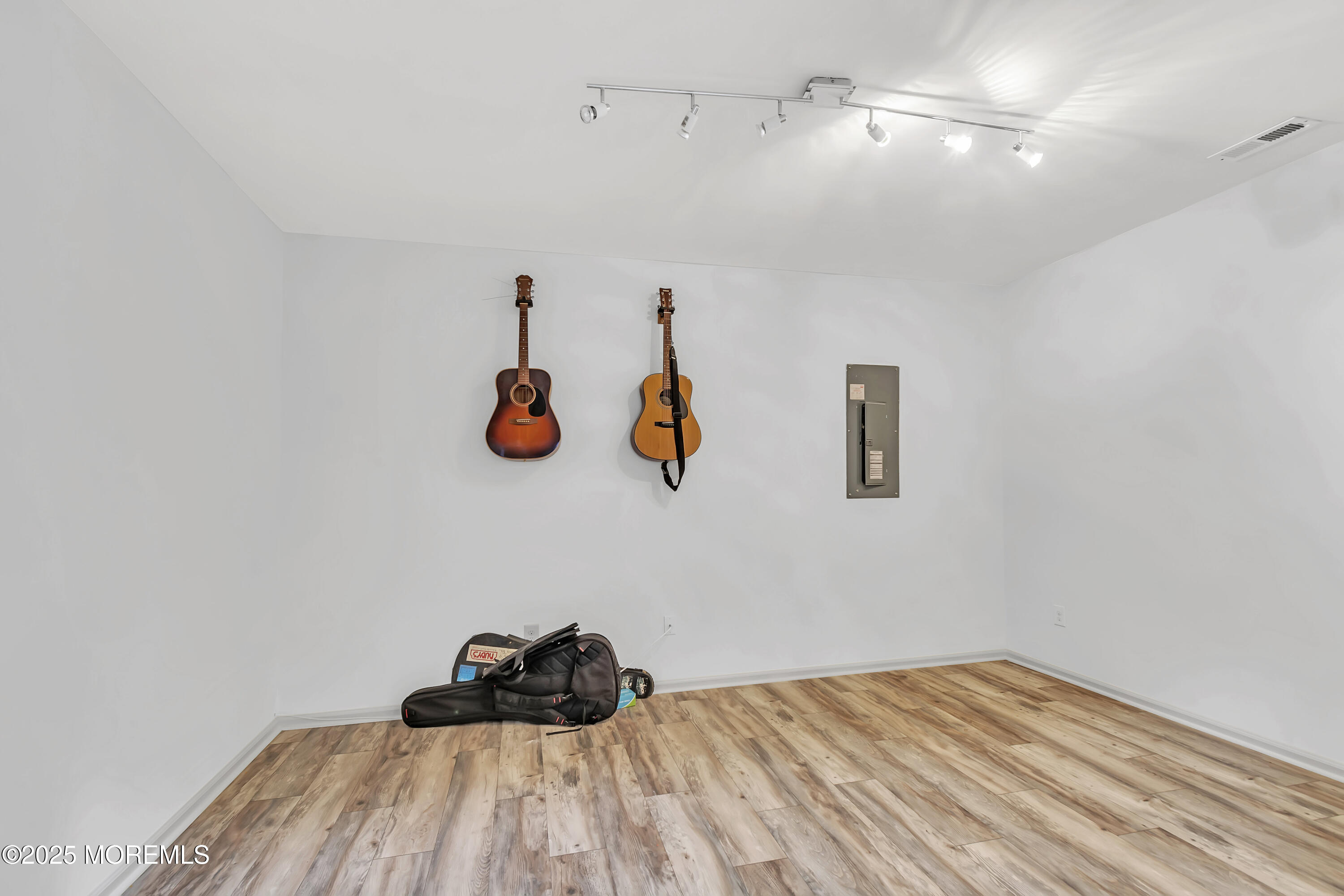 4 Christopher Drive Howell, NJ 07731 - Photo 6 of 41 a bedroom with a bed and a chandelier