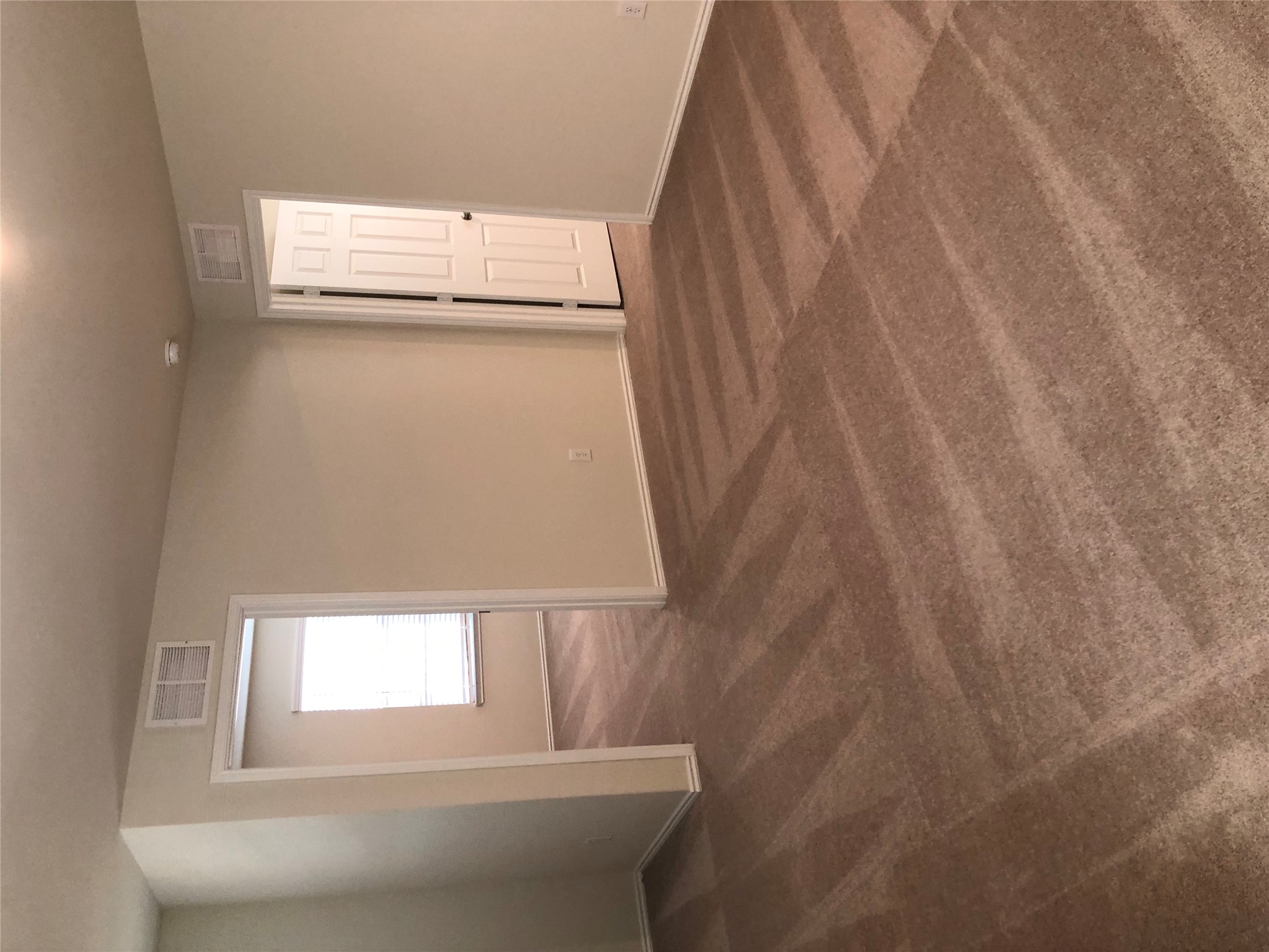 130 Lt Rusty Drive Jarrell, TX 76537 - Photo 12 of 13 Large second floor loft interior space features fresh carpet flooring throughout its spacious layout.