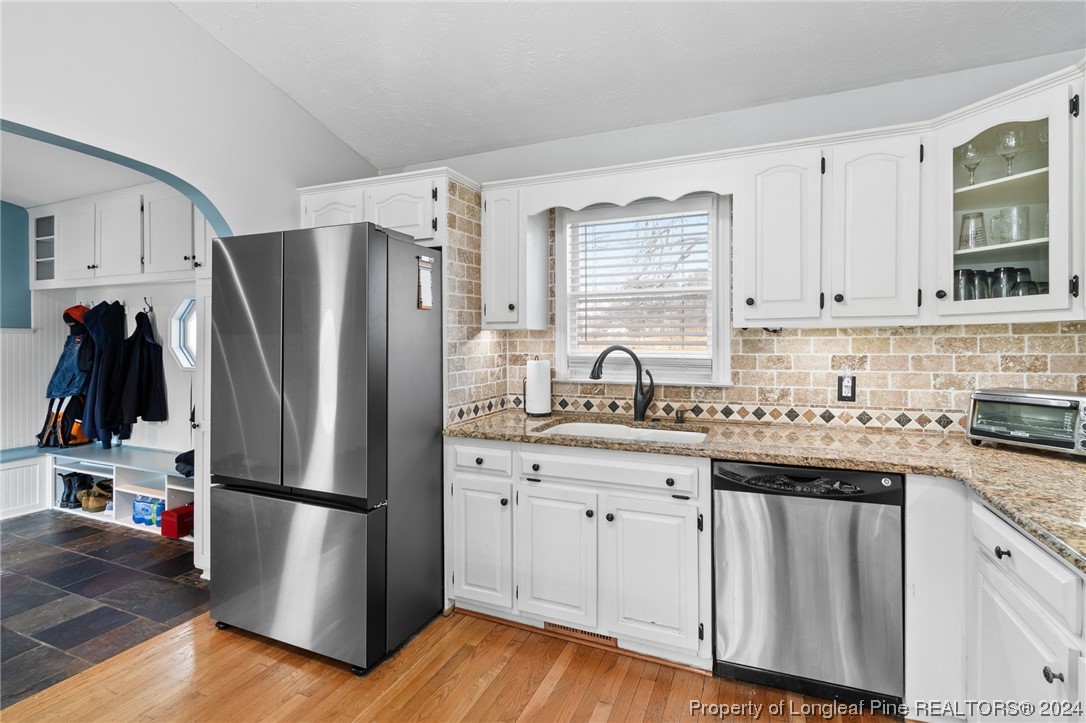 1177 Palestine Road Linden, NC 28356 - Photo 11 of 46 a kitchen with stainless steel appliances a refrigerator sink and cabinets