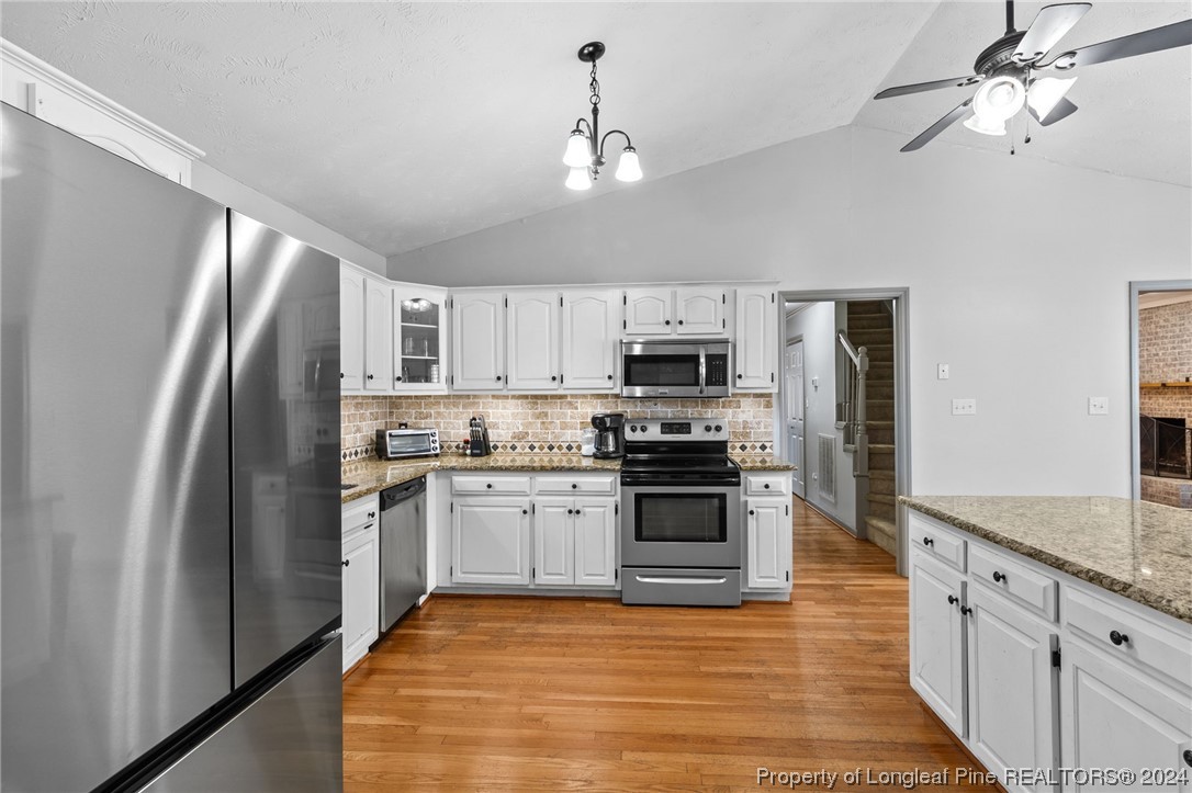 1177 Palestine Road Linden, NC 28356 - Photo 13 of 46 a kitchen with stainless steel appliances granite countertop a refrigerator a stove top oven a sink and dishwasher