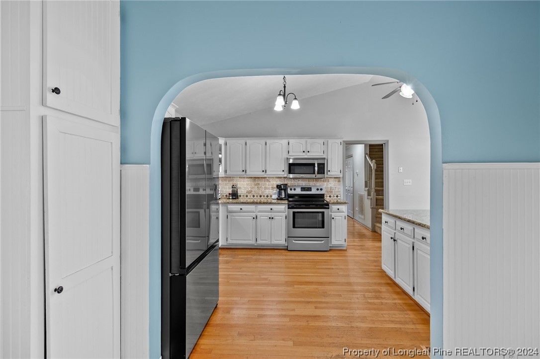 1177 Palestine Road Linden, NC 28356 - Photo 14 of 46 a kitchen with stainless steel appliances a refrigerator and a stove top oven