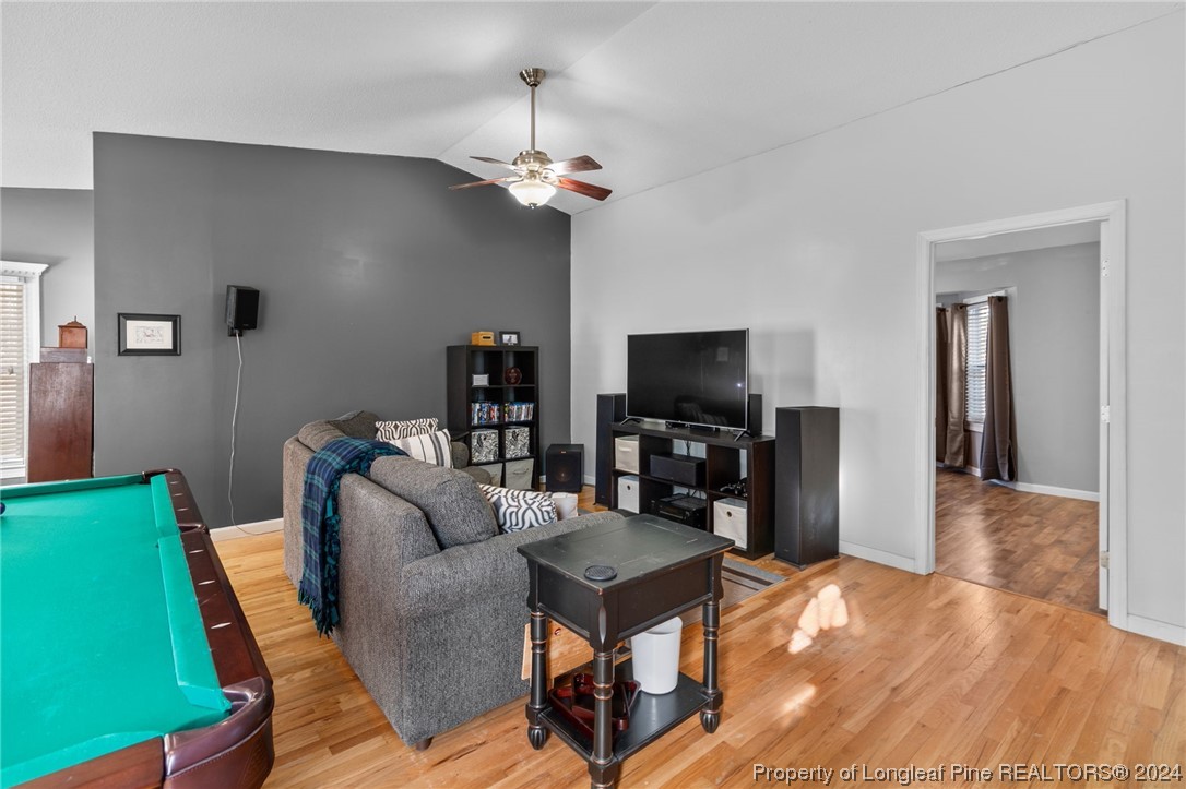 1177 Palestine Road Linden, NC 28356 - Photo 18 of 46 a living room with furniture and a flat screen tv