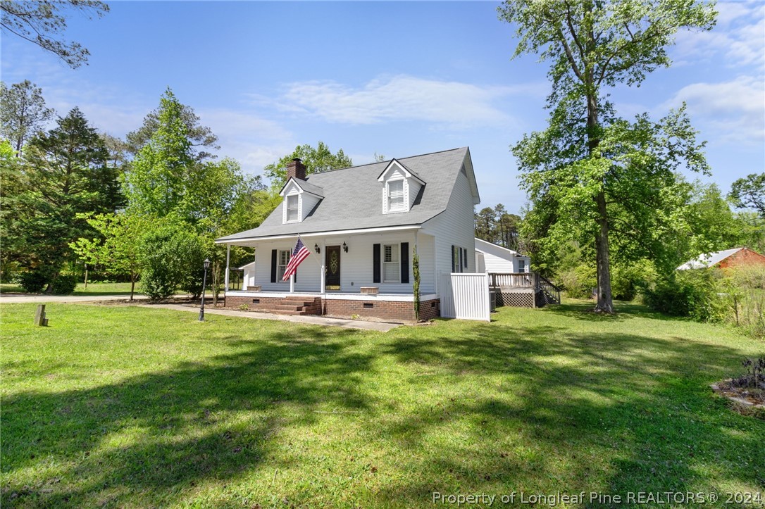 1177 Palestine Road Linden, NC 28356 - Photo 2 of 46 a front view of a house with a garden