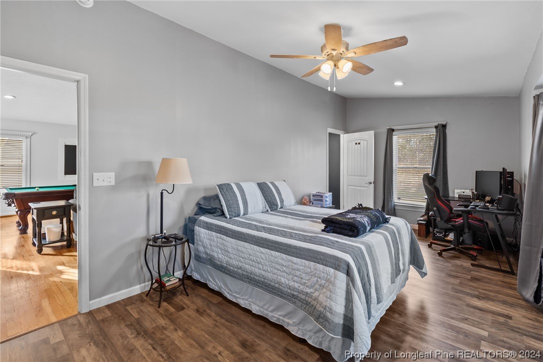 1177 Palestine Road Linden, NC 28356 - Photo 22 of 46 a bedroom with bed and a chandelier