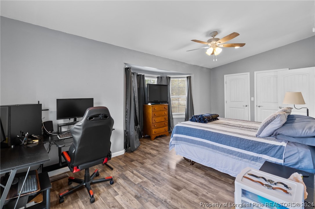 1177 Palestine Road Linden, NC 28356 - Photo 23 of 46 a bedroom with bed and a chandelier