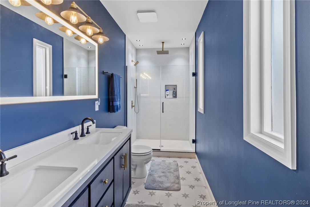 1177 Palestine Road Linden, NC 28356 - Photo 24 of 46 a bathroom with a sink and a mirror