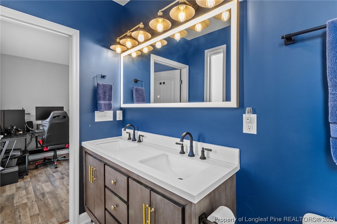 1177 Palestine Road Linden, NC 28356 - Photo 26 of 46 a bathroom with a sink vanity and a mirror