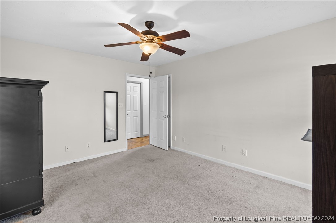 1177 Palestine Road Linden, NC 28356 - Photo 28 of 46 an empty room with closet and a chandelier fan
