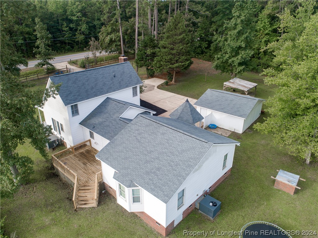 1177 Palestine Road Linden, NC 28356 - Photo 43 of 46 an aerial view of a house with a garden and lake view