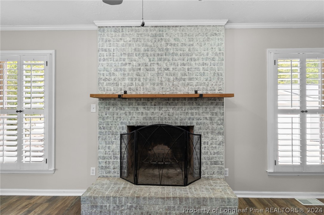 1177 Palestine Road Linden, NC 28356 - Photo 6 of 46 a living room with a fireplace and a table
