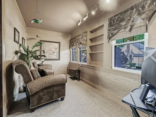 a living room with furniture and a window