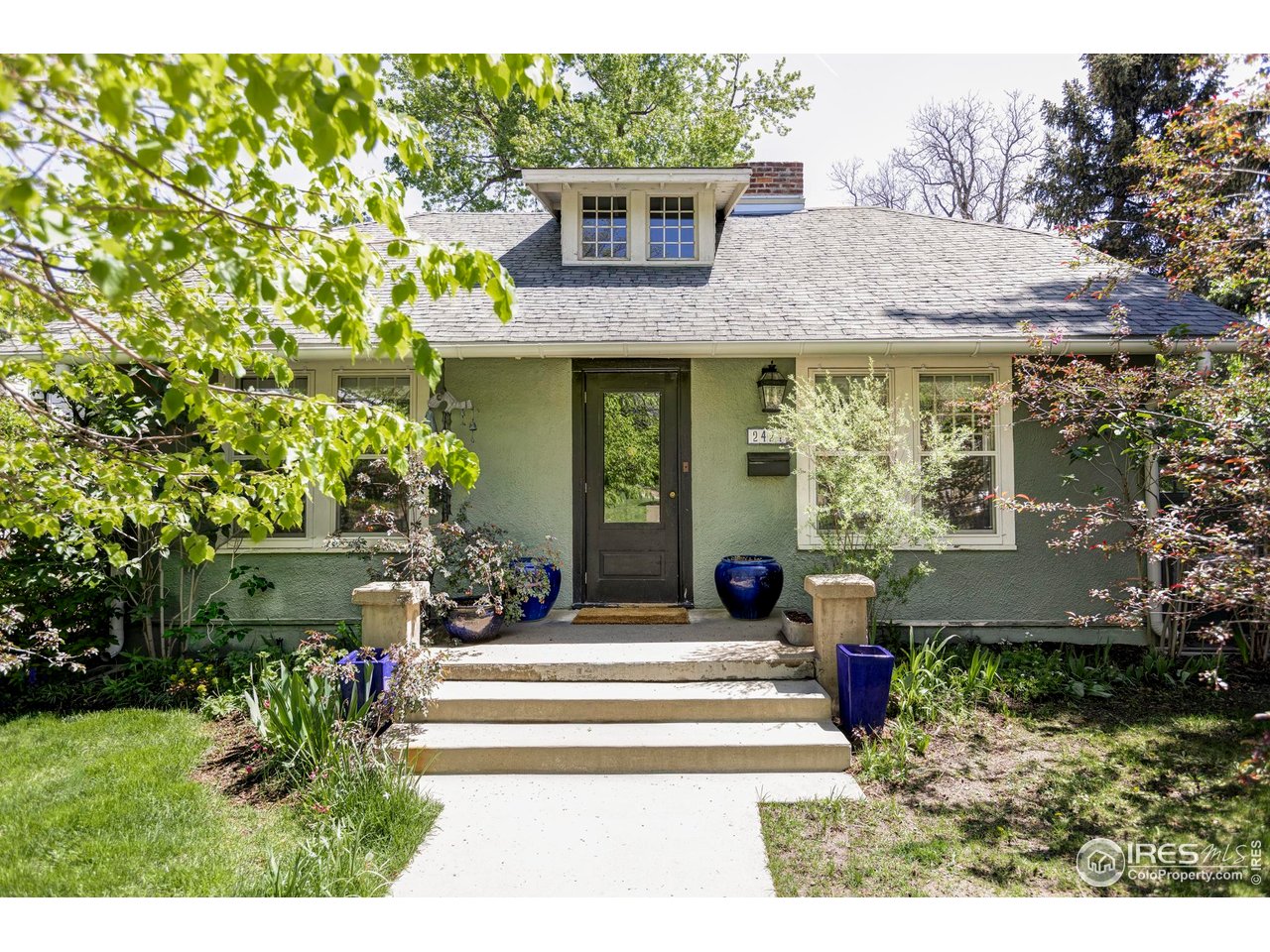 2424 4th Street Boulder, CO 80304 - Photo 1 of 29 a front view of a house with garden