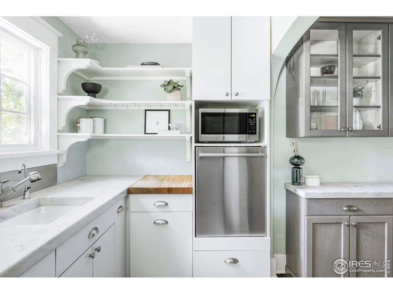 2424 4th Street Boulder, CO 80304 - Photo 11 of 29 a kitchen with kitchen island a sink stainless steel appliances and cabinets