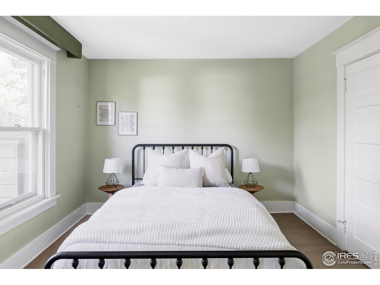 2424 4th Street Boulder, CO 80304 - Photo 13 of 29 a bed sitting in a bedroom next to a window