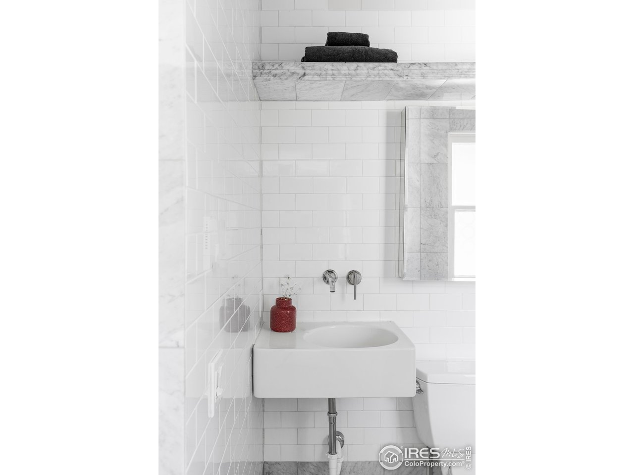 2424 4th Street Boulder, CO 80304 - Photo 15 of 29 a bathroom with a sink and a mirror