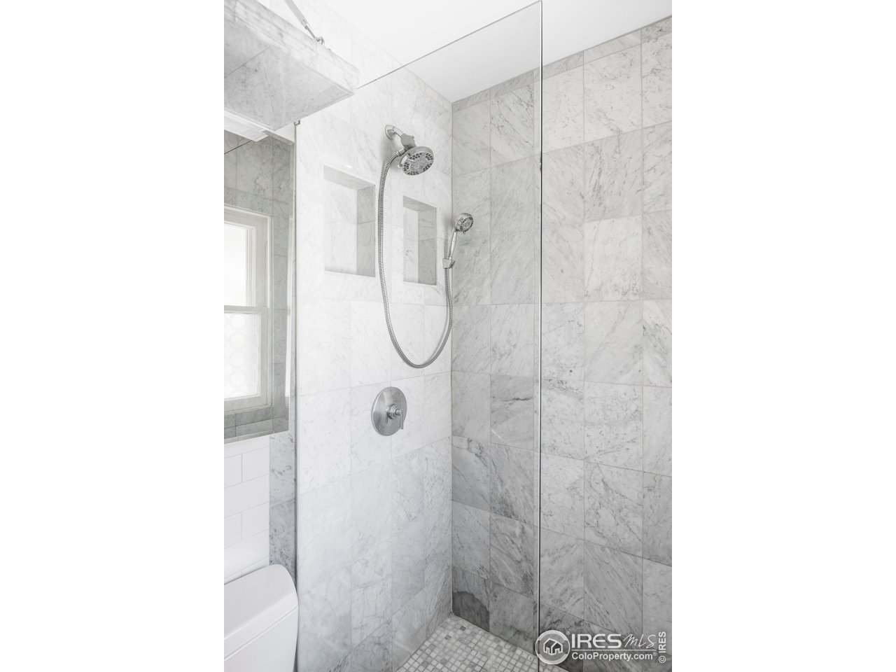 2424 4th Street Boulder, CO 80304 - Photo 16 of 29 a bathroom with a glass shower door