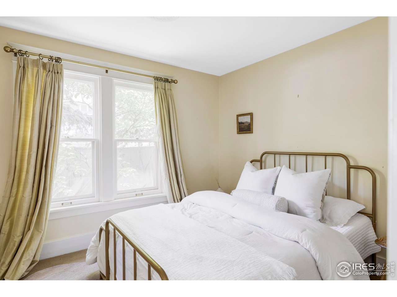 2424 4th Street Boulder, CO 80304 - Photo 18 of 29 a bedroom with a bed and a window