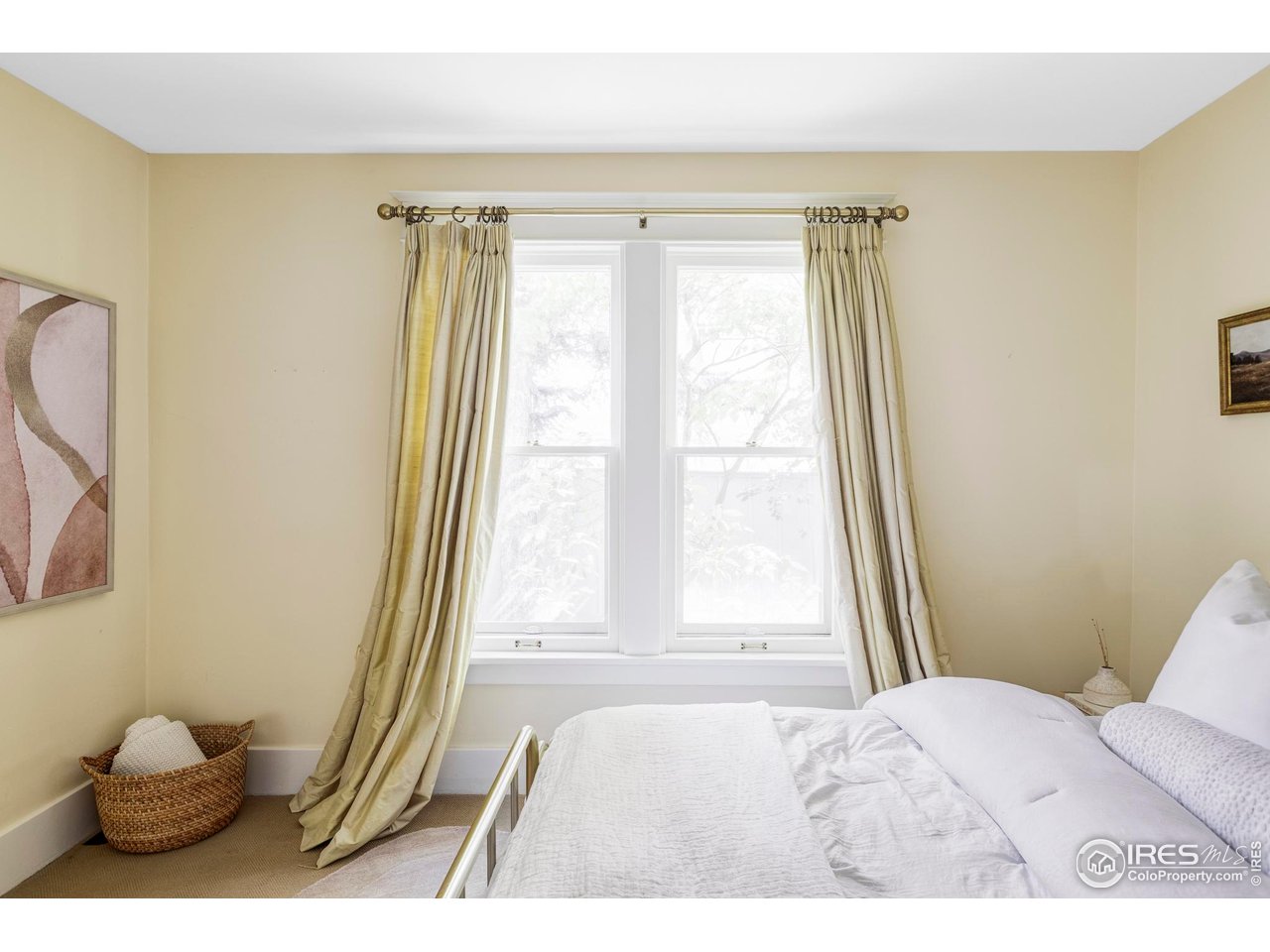 2424 4th Street Boulder, CO 80304 - Photo 19 of 29 a bedroom with a bed and a large window