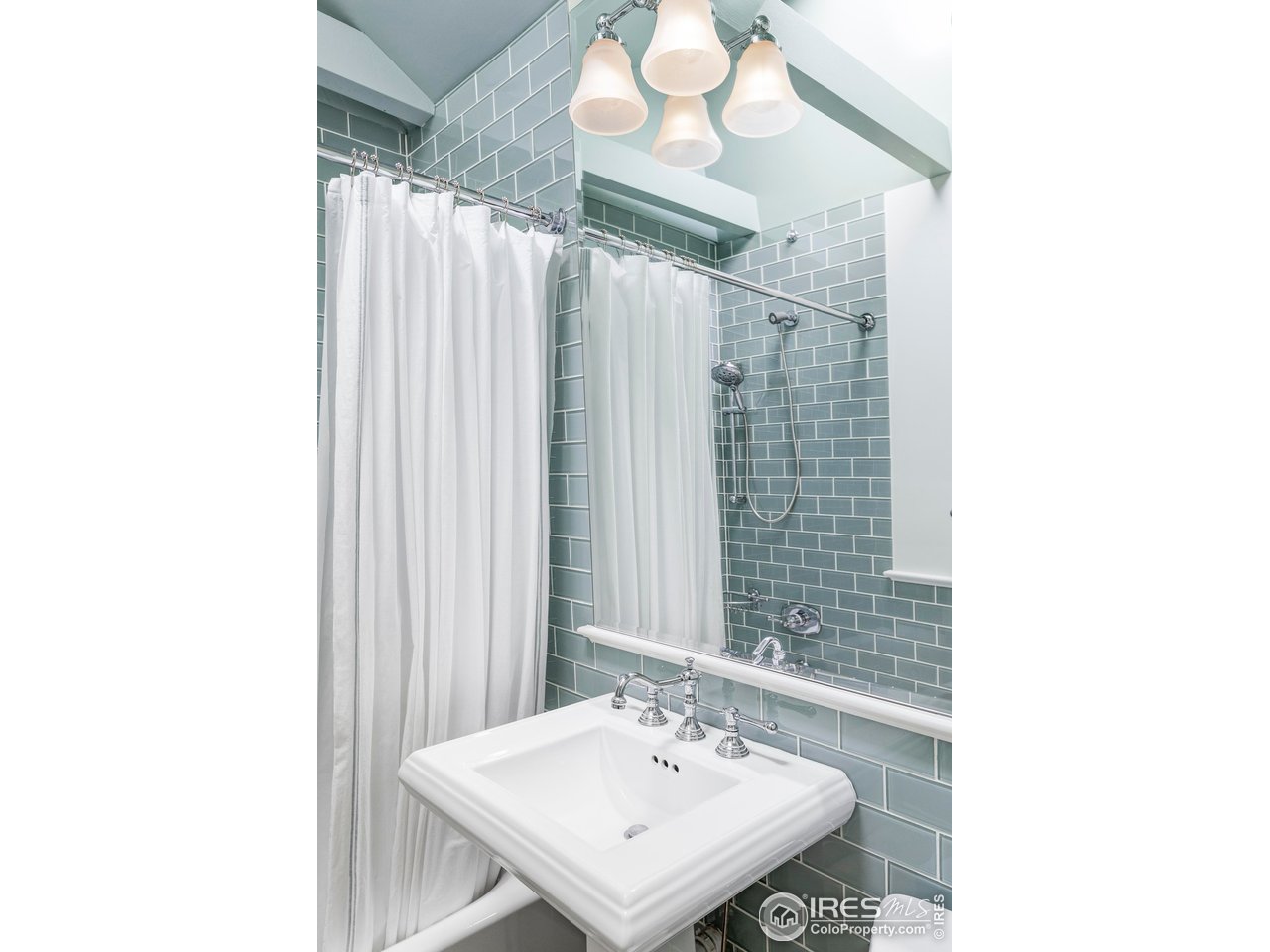 2424 4th Street Boulder, CO 80304 - Photo 20 of 29 a bathroom with a sink and a mirror