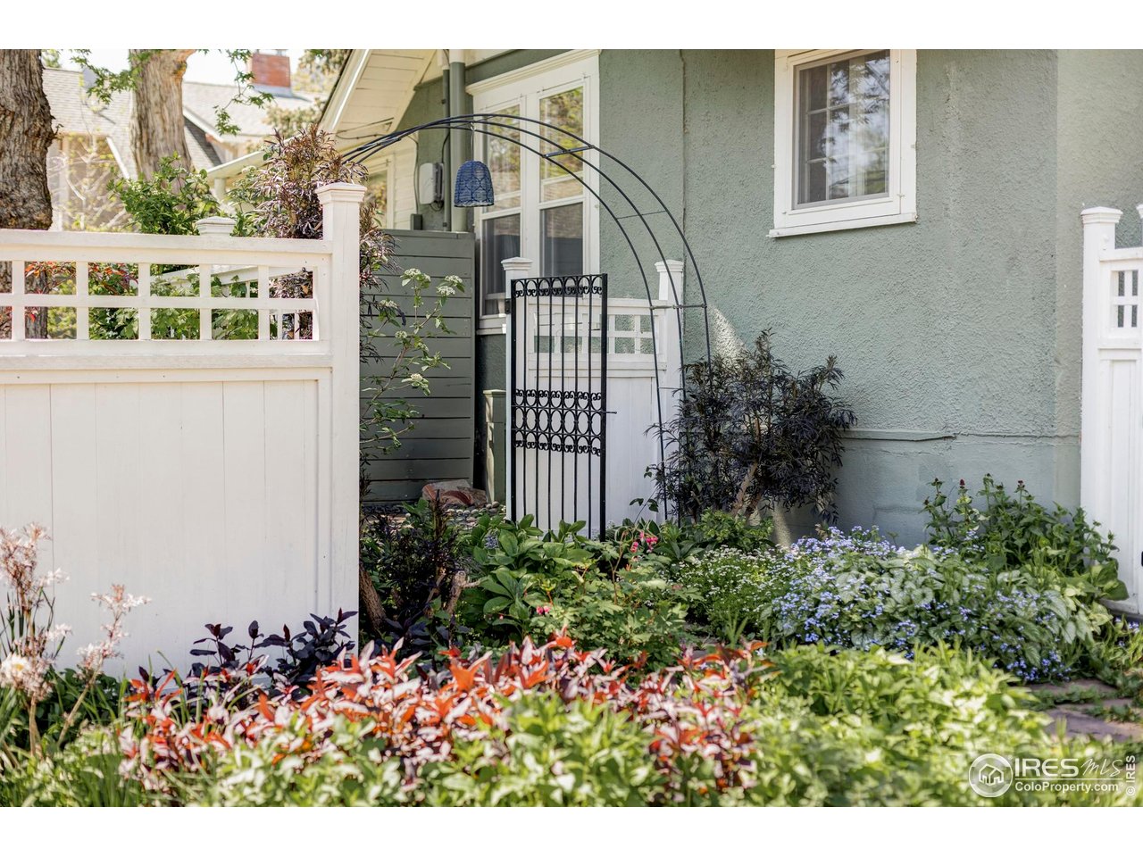 2424 4th Street Boulder, CO 80304 - Photo 28 of 29 a view of a house with a flower garden