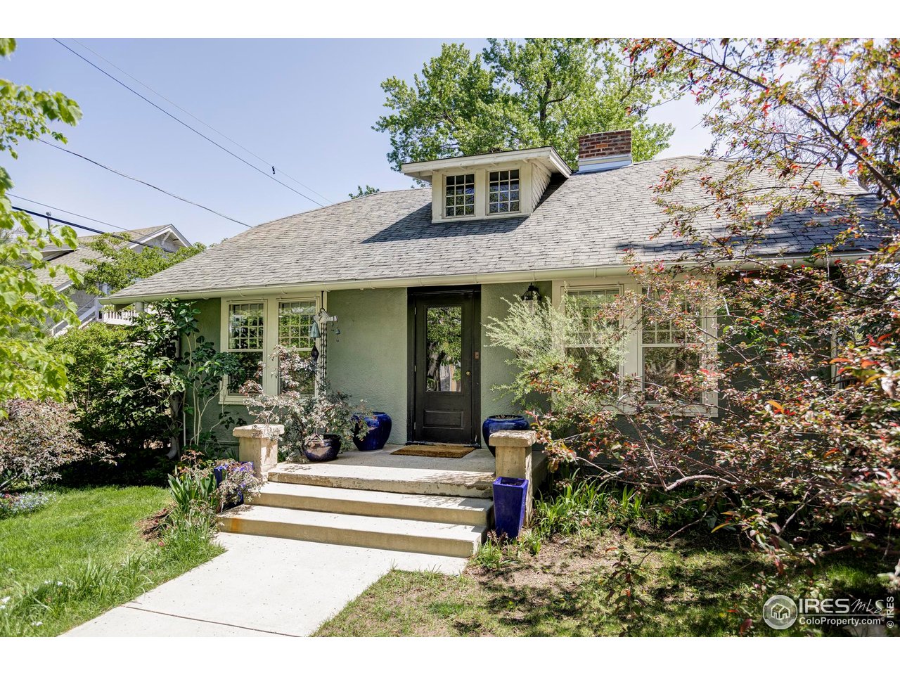 2424 4th Street Boulder, CO 80304 - Photo 29 of 29 a front view of a house with a garden