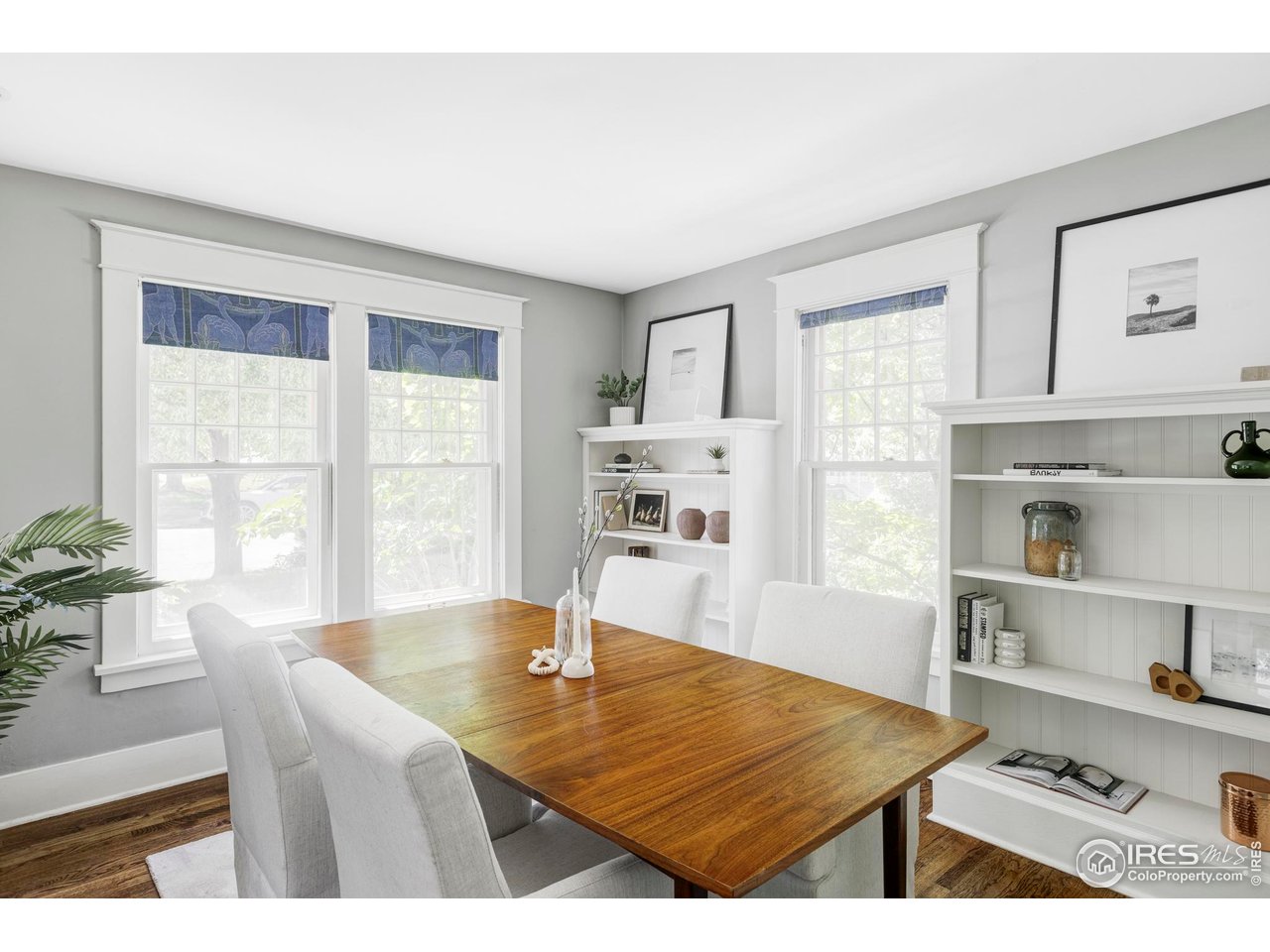 2424 4th Street Boulder, CO 80304 - Photo 4 of 29 a living room with kitchen island a table and a large window with wooden floor