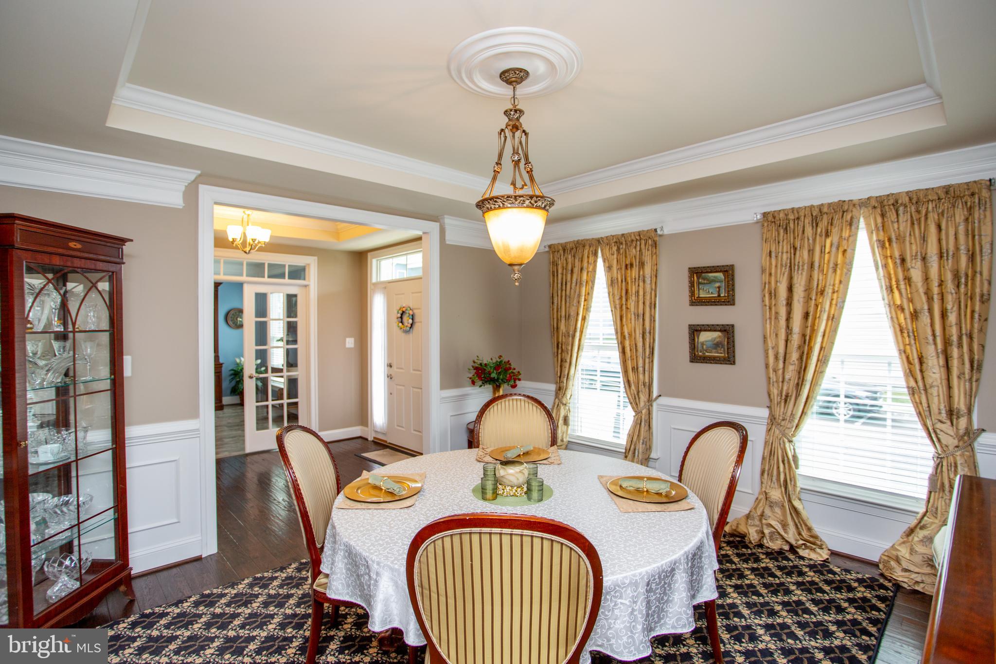 4682 Plough Tavern Road Doylestown, PA 18902 - Photo 5 of 42 a dining room with furniture a chandelier and window