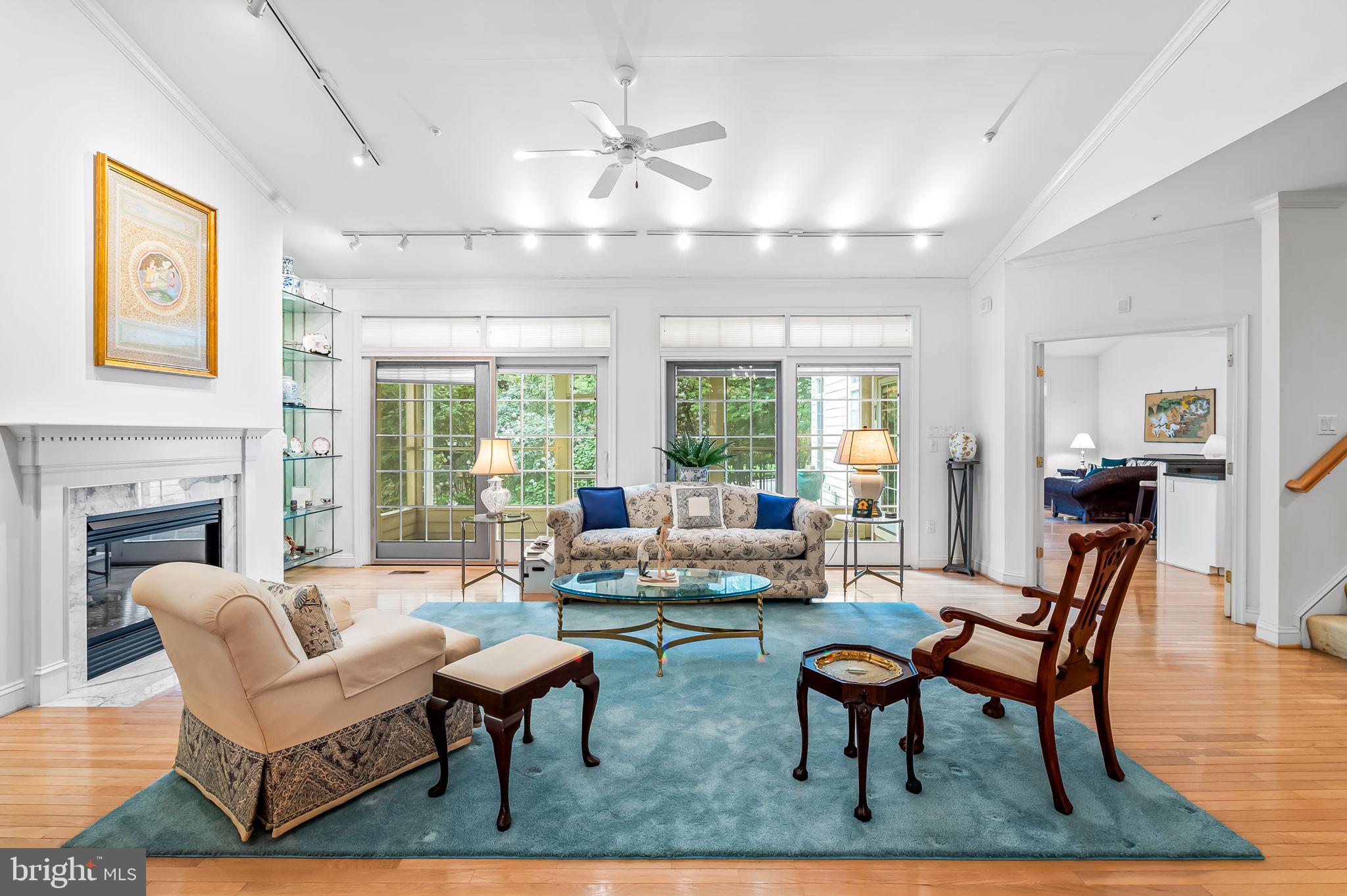 16 Roland Green, Unit 8 Baltimore, MD 21210 - Photo 11 of 55 a living room with fireplace furniture and a large window