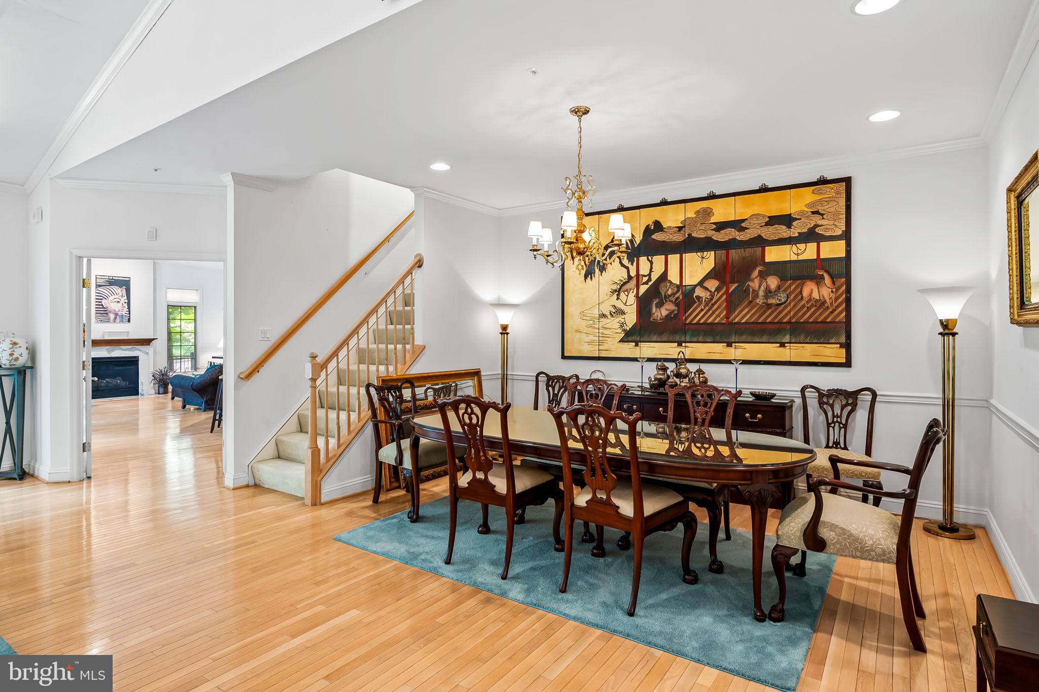 16 Roland Green, Unit 8 Baltimore, MD 21210 - Photo 13 of 55 a view of a a dining room with furniture wooden floor and chandelier