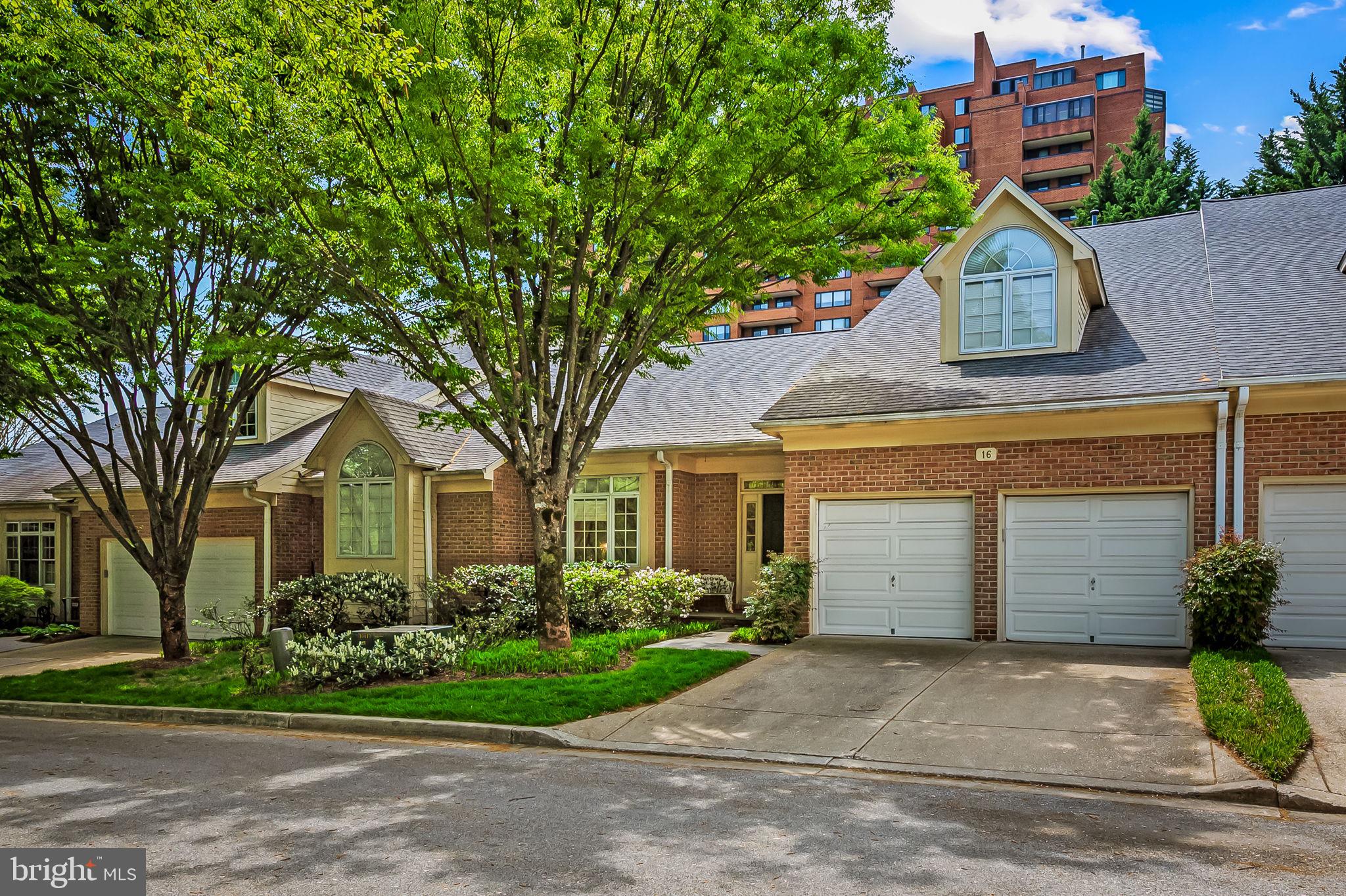 16 Roland Green, Unit 8 Baltimore, MD 21210 - Photo 2 of 55 a house that has a tree in front of it