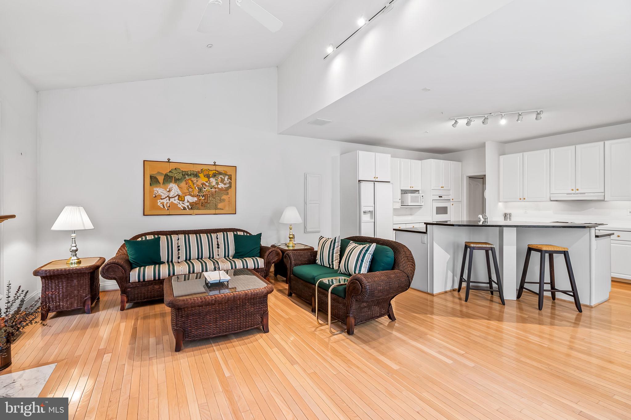 16 Roland Green, Unit 8 Baltimore, MD 21210 - Photo 21 of 55 a living room with furniture and a wooden floor