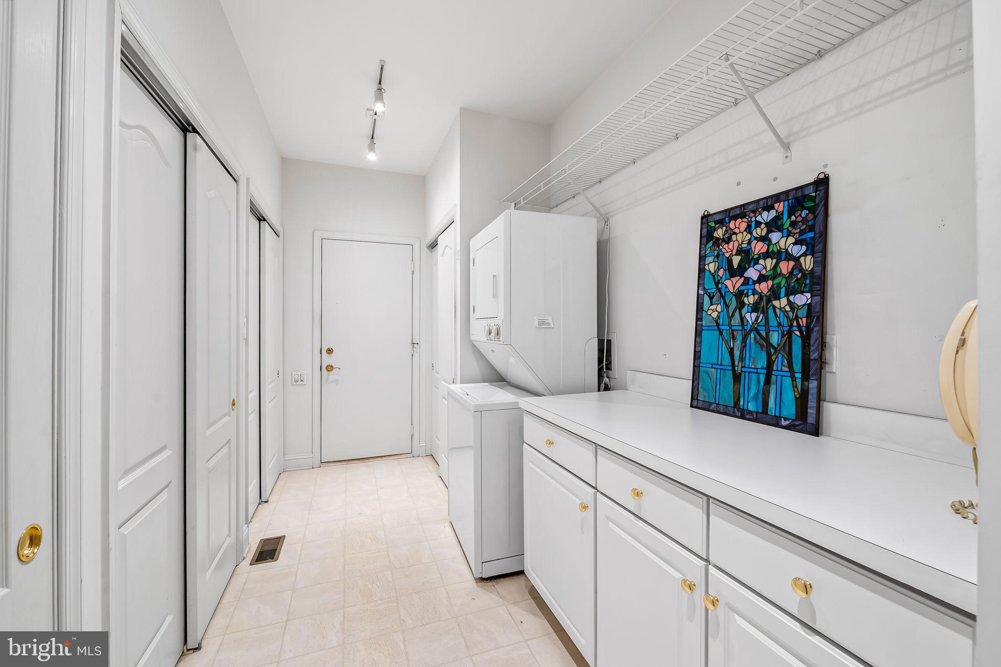 16 Roland Green, Unit 8 Baltimore, MD 21210 - Photo 24 of 55 a view of a kitchen with cabinets and a wooden floor
