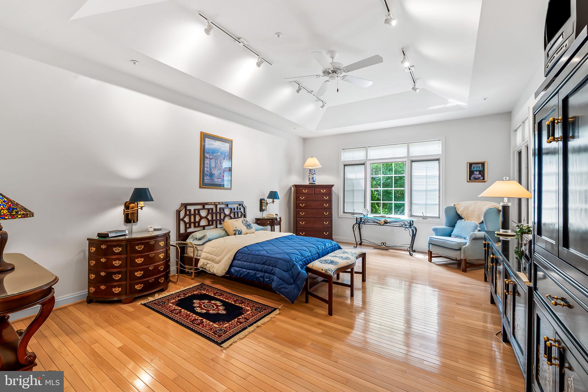 16 Roland Green, Unit 8 Baltimore, MD 21210 - Photo 26 of 55 a bedroom with furniture and a large window