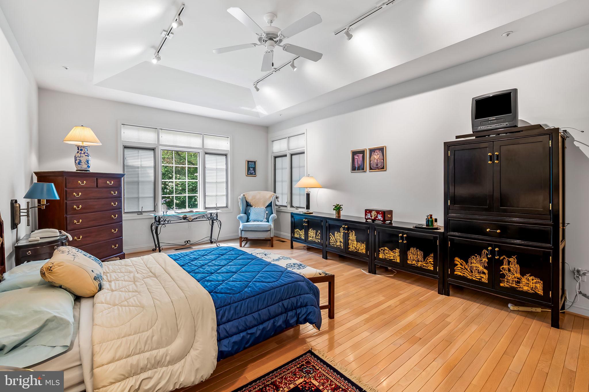 16 Roland Green, Unit 8 Baltimore, MD 21210 - Photo 27 of 55 a bedroom with furniture and a flat screen tv