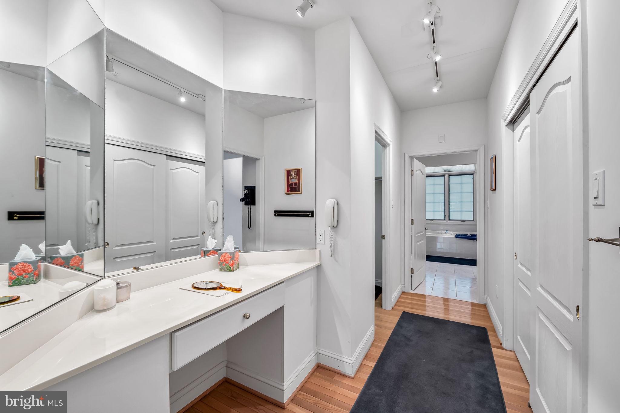 16 Roland Green, Unit 8 Baltimore, MD 21210 - Photo 29 of 55 a bathroom with a sink double vanity shower and a mirror
