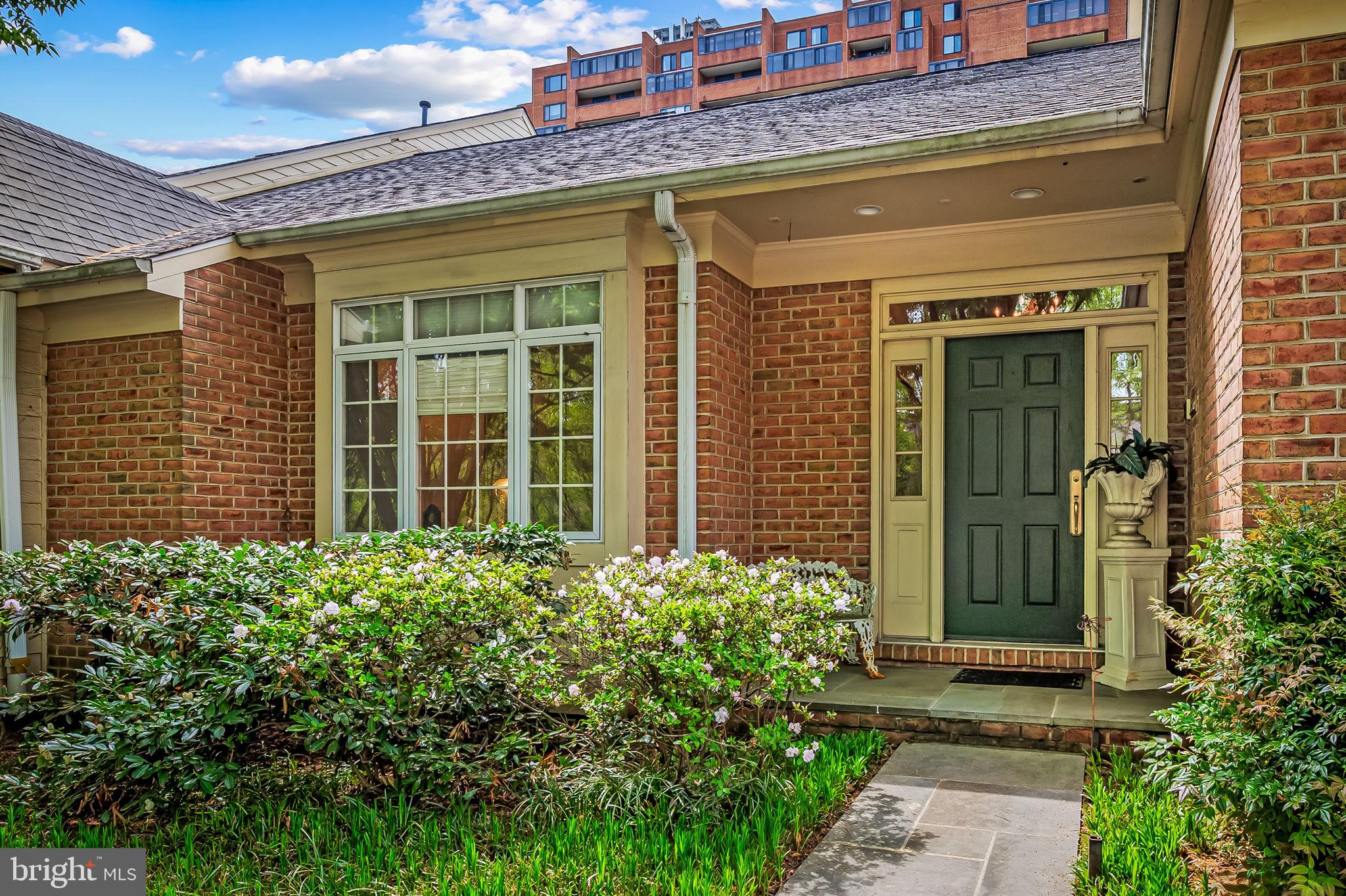 16 Roland Green, Unit 8 Baltimore, MD 21210 - Photo 3 of 55 a front view of a house with a garden