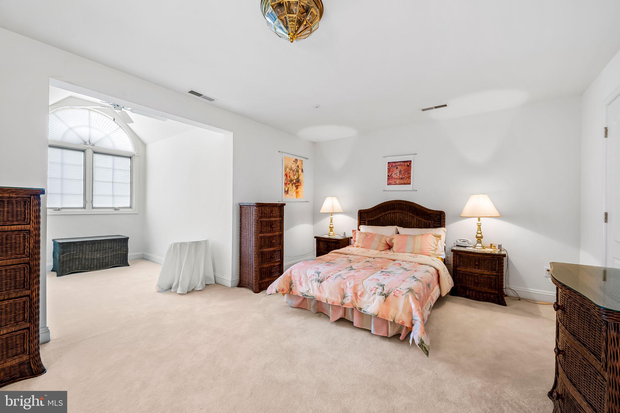 16 Roland Green, Unit 8 Baltimore, MD 21210 - Photo 35 of 55 a bedroom with bed and window