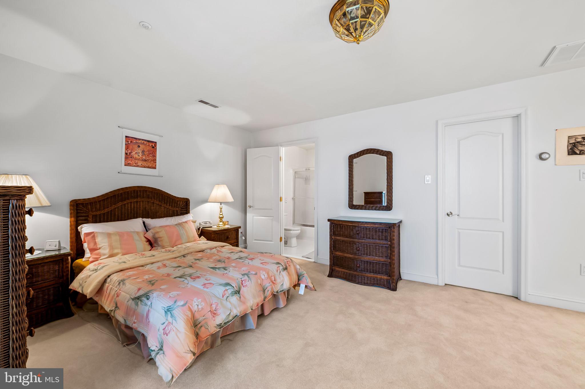 16 Roland Green, Unit 8 Baltimore, MD 21210 - Photo 36 of 55 a bedroom with bed and cabinets