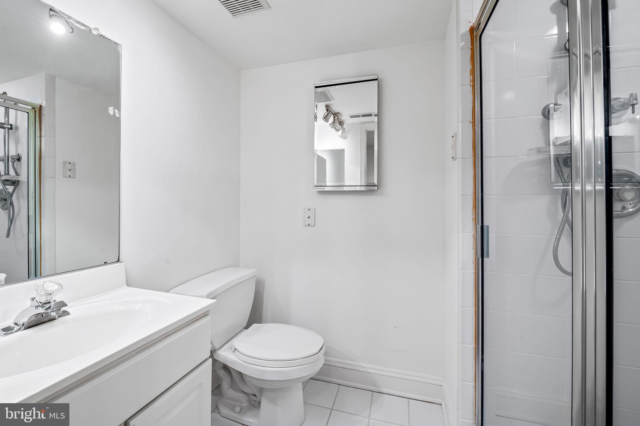 16 Roland Green, Unit 8 Baltimore, MD 21210 - Photo 45 of 55 a bathroom with a sink toilet and shower