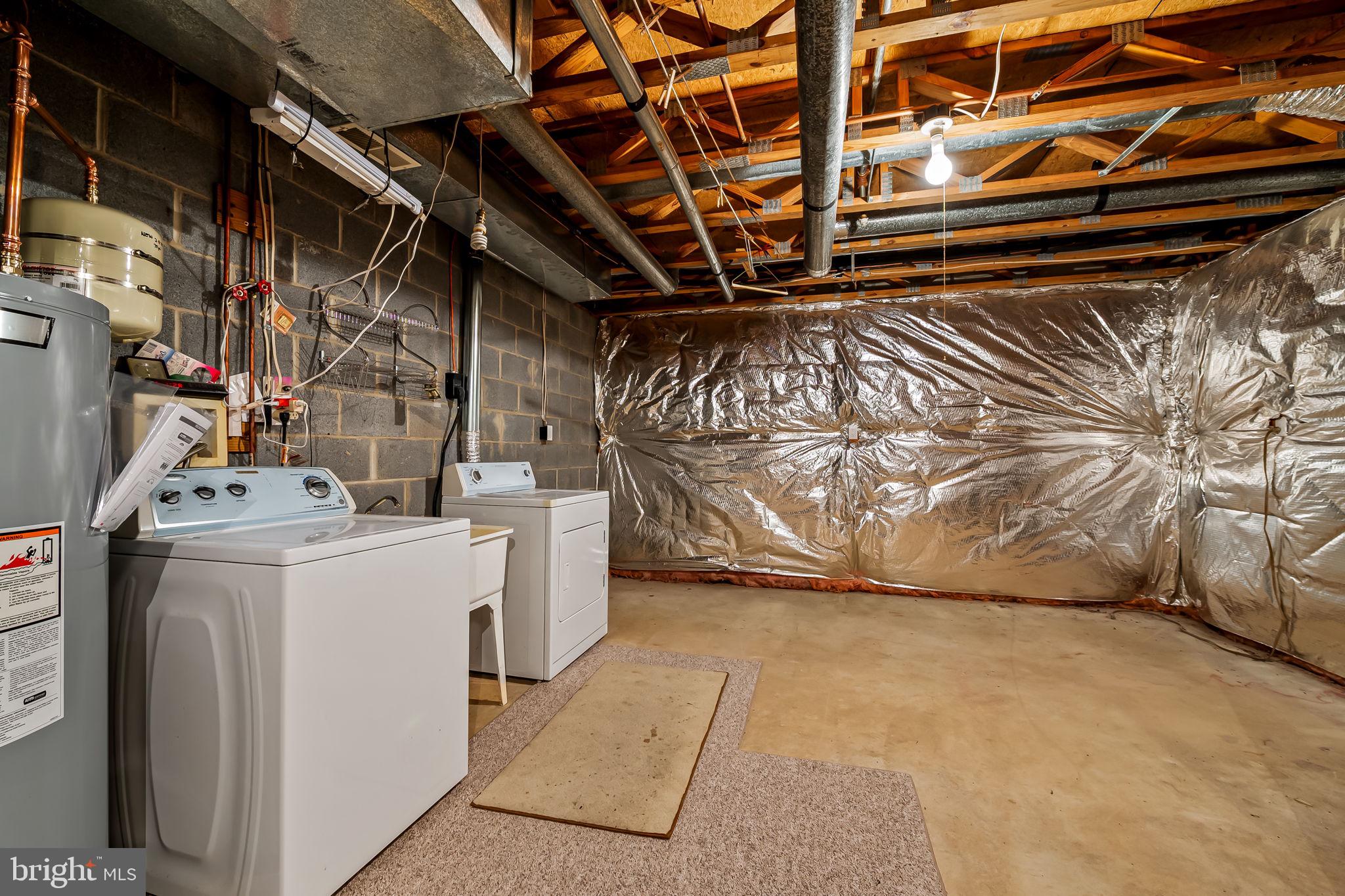 16 Roland Green, Unit 8 Baltimore, MD 21210 - Photo 46 of 55 a view of storage and utility room with washer and dryer