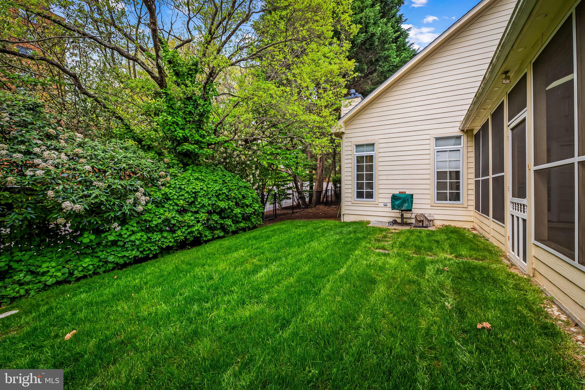 16 Roland Green, Unit 8 Baltimore, MD 21210 - Photo 50 of 55 a view of a backyard with table and chairs and potted plants