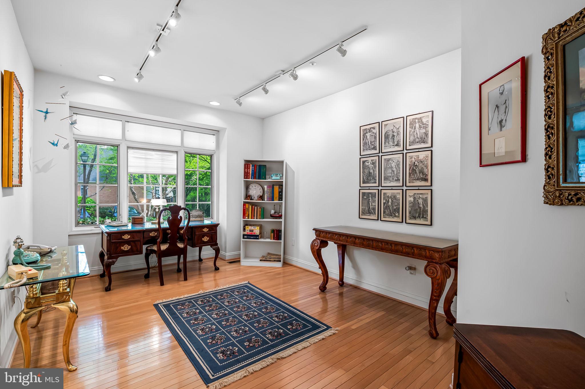 16 Roland Green, Unit 8 Baltimore, MD 21210 - Photo 7 of 55 a living room with furniture rug and window
