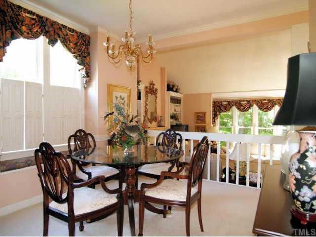 5711 Sentinel Drive Raleigh, NC 27609 - Photo 3 of 12 Overlooks living room, windows have shutters plus a window seat. Dining Room